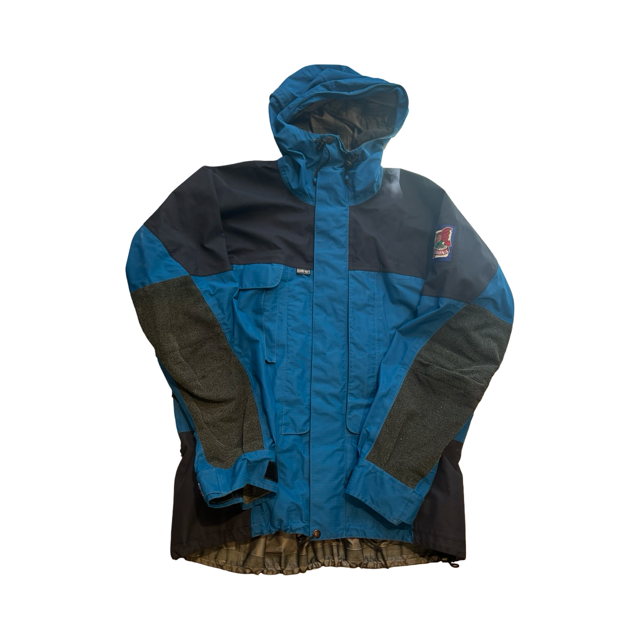 Norröna Arch Wall skaljacka för herr i blått och svart med grå förstärkningar, sedd framifrån på vit bakgrund.