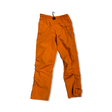 Orange funktionsbyxa från Fjällräven för dam, fotograferad framifrån mot en vit bakgrund.