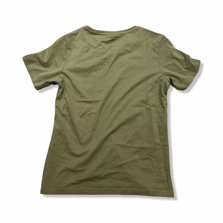Baksidan av en grön T-shirt från Lundhags Knak Tee för dam, fotograferad mot en vit bakgrund.