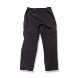 Baksidan av ett par mörkblå Fjällräven Abisko Hybrid Trail Trousers för dam, fotograferade mot en vit bakgrund.