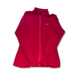 Rosa fleecetröja för dam från Helly Hansen med dragkedja och logotyp, fotograferad mot vit bakgrund.