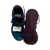 Salomon GTX Trailster löparskor för dam i blått och lila, där ena skon visar sulan, mot vit bakgrund.